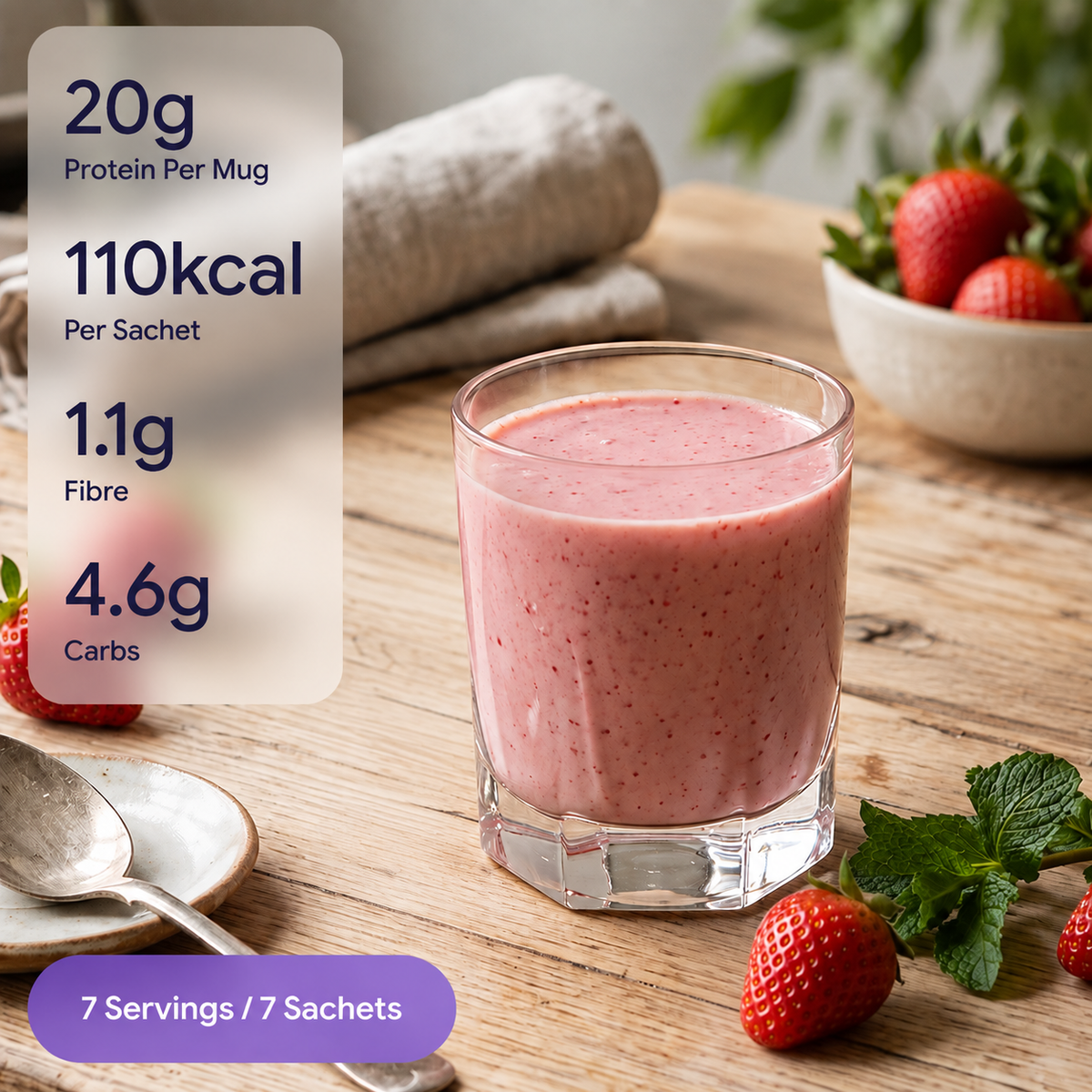 A pink berry smoothie in a clear glass on a wooden table, with a nutrition callout overlay showing 20g protein per mug, 110kcal per sachet, 1.1g fibre, and 4.